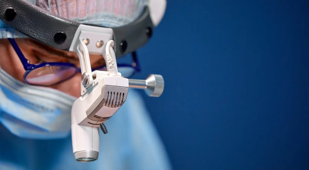 A dental surgeon checking teeth for patient